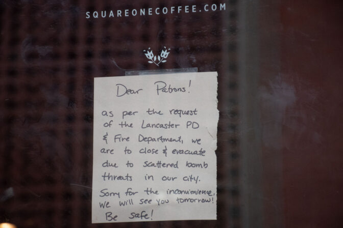 A handwritten note explaining the sudden closure of Square One Cafe, located on N. Duke Street, is hung up on the establishment's door during an evacuation order made in the area due to multiple threats in Lancaster City on Saturday, March. 23, 2024.