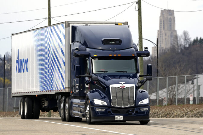 A self-driving tractor trailer maneuvers around a test track in Pittsburgh, Thursday, March 14, 2024. The truck, outfitted with 25 laser, radar and camera sensors, is owned by Pittsburgh-based Aurora Innovation Inc. Late this year, Aurora plans to start hauling freight on Interstate 45 between the Dallas and Houston areas with 20 driverless trucks. (AP Photo/Gene J. Puskar)