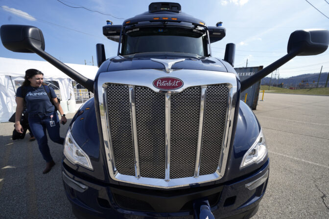 A self-driving tractor trailer is displayed at a test track in Pittsburgh, Thursday, March 14, 2024. The truck, outfitted with 25 laser, radar and camera sensors, is owned by Pittsburgh-based Aurora Innovation Inc. Late this year, Aurora plans to start hauling freight on Interstate 45 between the Dallas and Houston areas with 20 driverless trucks. (AP Photo/Gene J. Puskar)