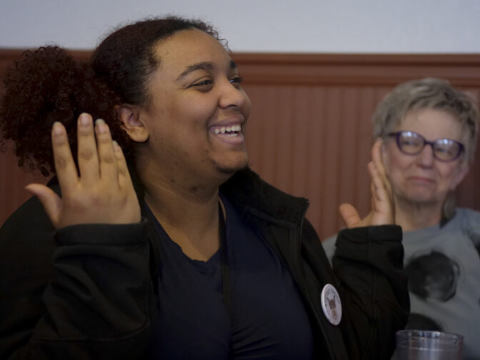 Alliyah Perry moved to Centralia, Wash., in 2020. She started farming and opened local food store Farm+Flourish in 2023. She talks about her love of farming during coffee and breakfast with other business owners at Dawn's Delectables as Rebecca Staebler, owner of HUBBUB gift and craft boutique, listens on March 8, 2024. (Jeremy Long - WITF)