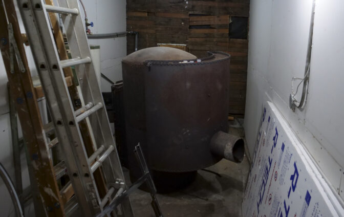The old wood boiler used to heat Hope Grange #155 in Winlock, Washington on March 5, 2024. (Jeremy Long - WITF)