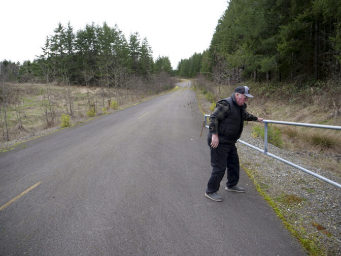 Bob Guenther, president of the Thurston-Lewis-Mason Counties Labor Council, opens the gate to give a tour of the Industrial Park at TransAlta site on March 6, 2024. Australia-based Fortescue Future Industries is considering the site for a green hydrogen facility. (Jeremy Long - WITF)