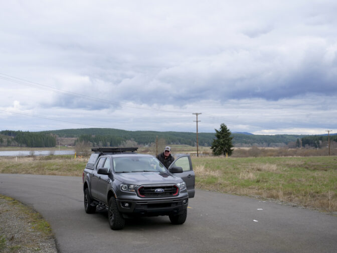 Bob Guenther, president of the Thurston-Lewis-Mason Counties Labor Council, gets back into his truck to give a tour of the Industrial Park at TransAlta site on March 6, 2024. Australia-based Fortescue Future Industries is considering the site for a green hydrogen facility. (Jeremy Long - WITF)