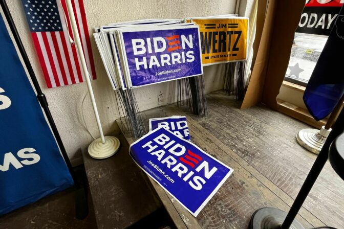 Campaign signs sit in the Erie County Democratic Party office in Erie, Pa.
