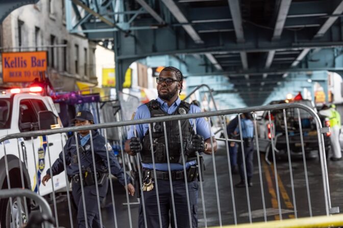 The Philadelphia police installed barricades along Kensington Avenue after removing people who were camped out there and cleaning the sidewalk. (Kimberly Paynter/WHYY)