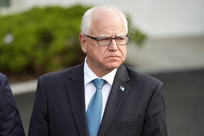 Minnesota Gov. Tim Walz listens as Maryland speaks to reporters after meeting with President Joe Biden, Wednesday, July 3, 2024, at the White House in Washington. (AP Photo/Jacquelyn Martin)