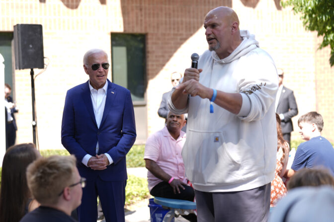 Sen. John Fetterman, D-Pa., speaks as President Joe Biden, left, listens at a campaign rally in Harrisburg, Pa., on Sunday, July 7, 2024. (AP Photo/Manuel Balce Ceneta)