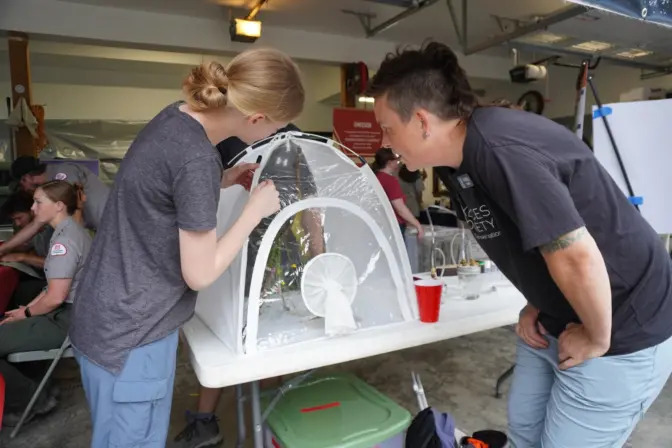 Susan Deering (left), who is majoring in cell biology and biochemistry at Bucknell University, talks with Kristy Gallo, a Bellefonte resident and an ambassador with the Xerces Society for Invertebrate Conservation, at the Pennsylvania Firefly Festival on June 28, 2024. Deering is assisting with firefly research as part of the Lower Lab, including research taking place in Forest County, Pennsylvania.