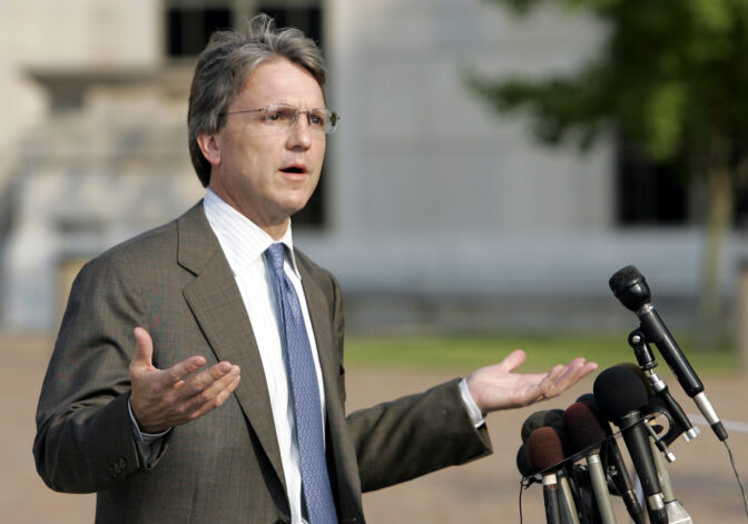 FILE - Paul Hamrick gestures while talking with reporters after the jury in the federal corruption trial against him, as well as former Gov. Don Siegelman, former HealthSouth CEO Richard Scrushy and Mack Roberts reported it was deadlocked on a verdict, June 22, 2006, in Montgomery, Ala. (AP Photo/Rob Carr, File)