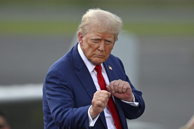 TOPSHOT - Former US President and Republican presidential candidate Donald Trump gestures during a campaign rally at the North Carolina Aviation Museum & Hall of Fame in Asheboro, North Carolina, August 21, 2024. (Photo by Peter Zay / AFP) (Photo by PETER ZAY/AFP via Getty Images)