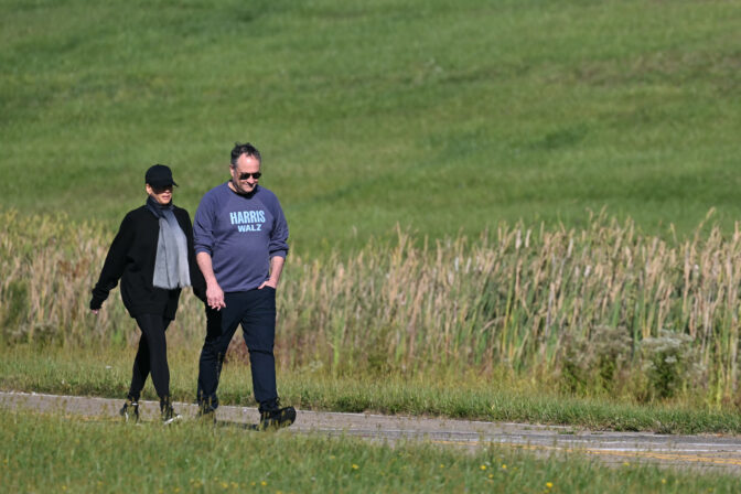 TOPSHOT - US Vice President and Democratic presidential candidate Kamala Harris (L) walks alongside husband US Second Gentleman Doug Emhoff at the Pennsylvania Air National Guard Base, 171st Air Refueling Wing, in Moon Township, Pennsylvania, September 8, 2024. (Photo by Mandel NGAN / AFP) (Photo by MANDEL NGAN/AFP via Getty Images)