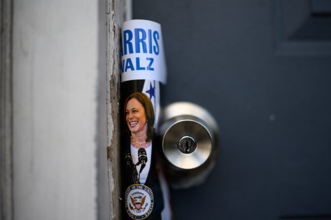 A Harris-Walz pamphlet is left on a door knob as Service Employee Union International members canvass latino voters in Philadelphia on Sunday, September 22, 2024. CREDIT: Kriston Jae Bethel for NPR