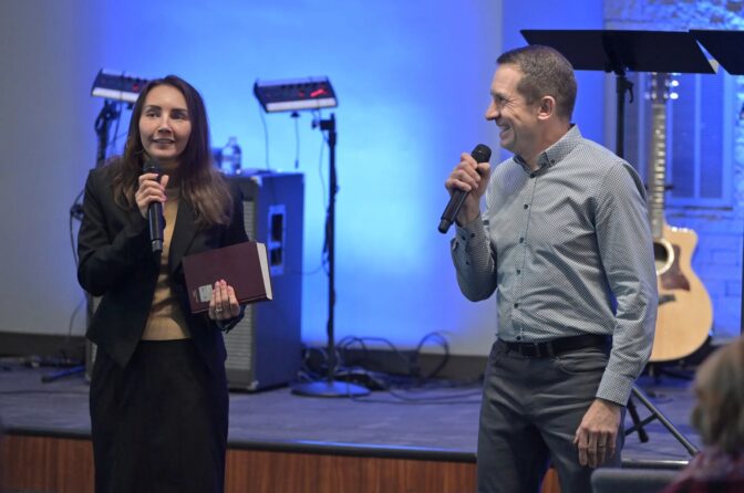Svetlana Kalash of Reading speaks English as Rev. Yaroslav Mantsevich translates in Russian at Brickerville Grace Fellowship in Lititz during the service on Sunday, Feb. 23, 2025.