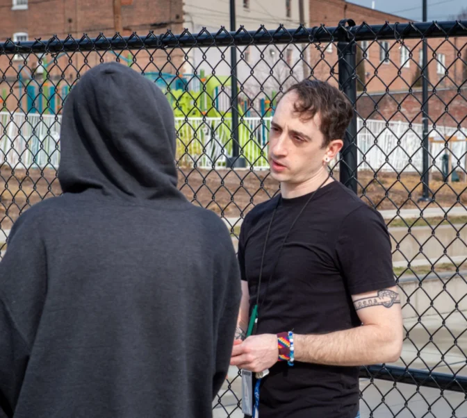Tenfold outreach worker Milan Koneff, right, talks to a homeless client at Culliton Park in the 200 Block of South Water Street in Lancaster city on Thursday, Feb. 27, 2025.