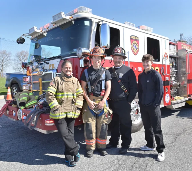 Linus Weber, a German exchange student, second from the left, is involved with the Garden Spot Fire Rescue and helped with a mock crash training scene held in the parking lot of Garden Spot High School on Thursday, April 17, 2025. Weber stands with his host family, from the left, Tabatha Nolt, Weber, Jared Nolt and Collin Burkholder, son of Tabatha Nolt.