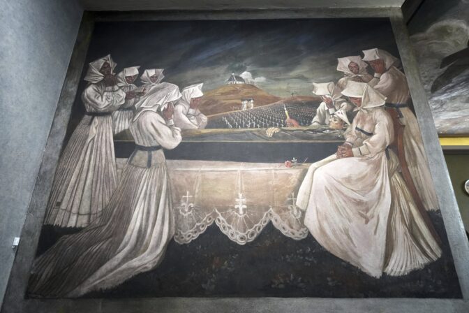 A mural by Croatian-American artist Maxo Vanka titled "Croatian Mother Raises Her Son for War" is displayed inside St. Nicholas Croatian Catholic Church  in Millvale, Pa., Tuesday, March 18, 2025. (AP Photo/Gene J. Puskar)