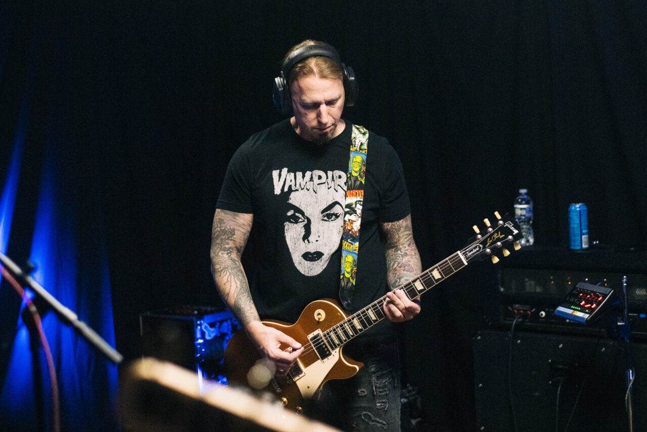 Joe Defiant playing guitar.