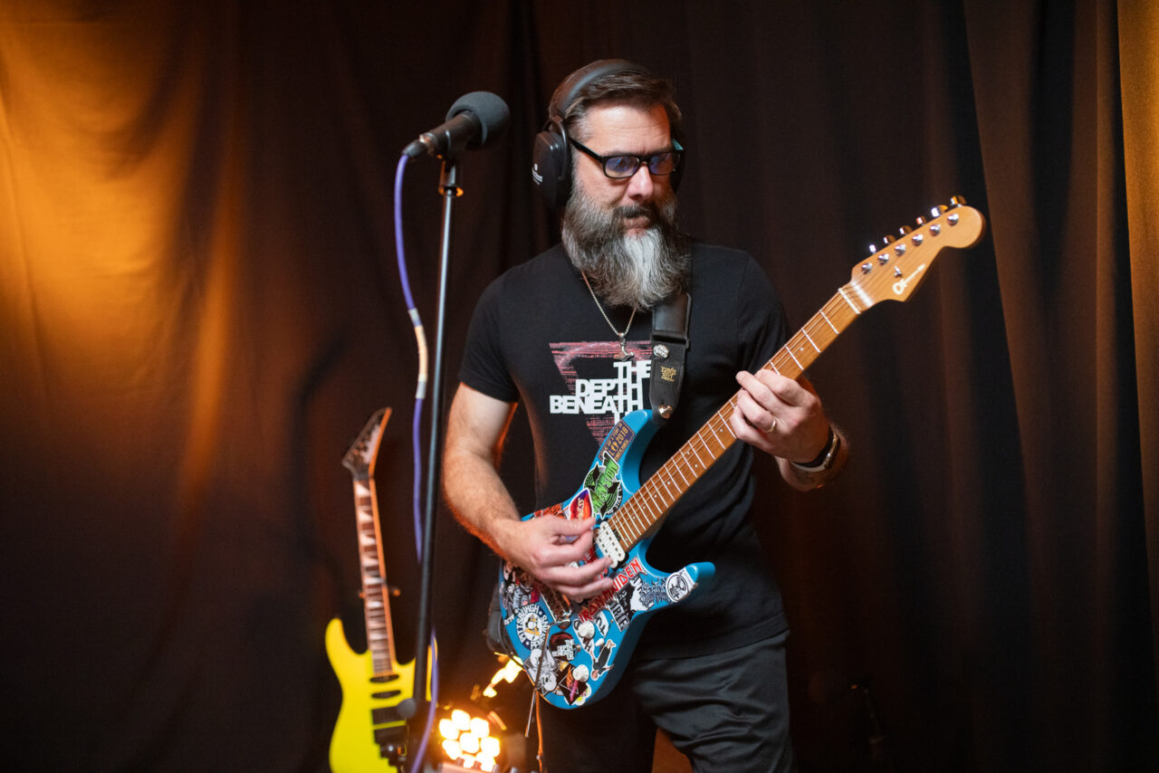 Andy Cornman playing guitar.