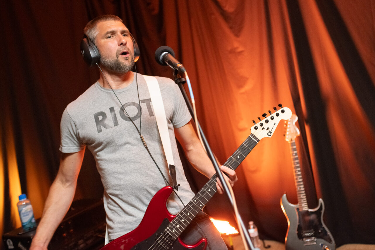 Jed Bridge playing guitar