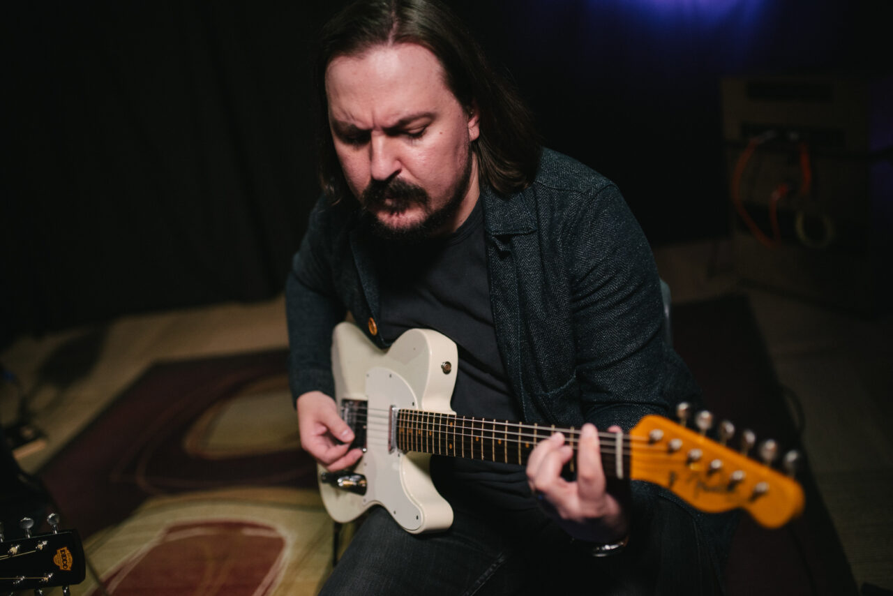 Jeremiah McCann playing electric guitar.