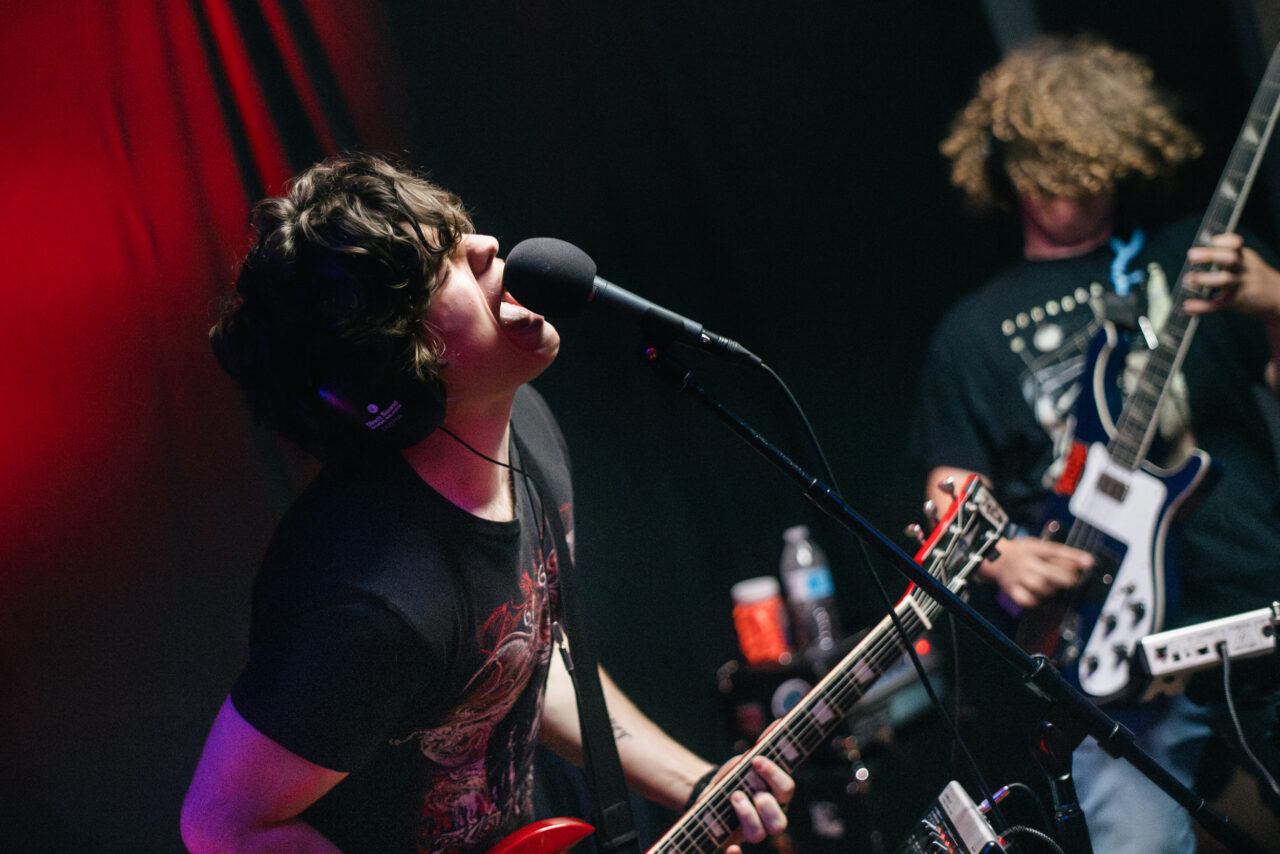 A singer shouting into a microphone