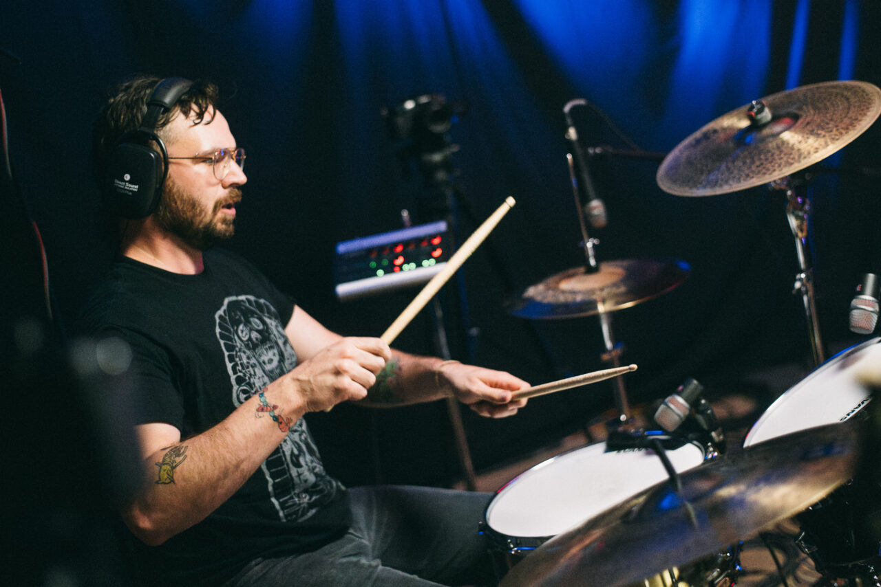 A person playing drums.