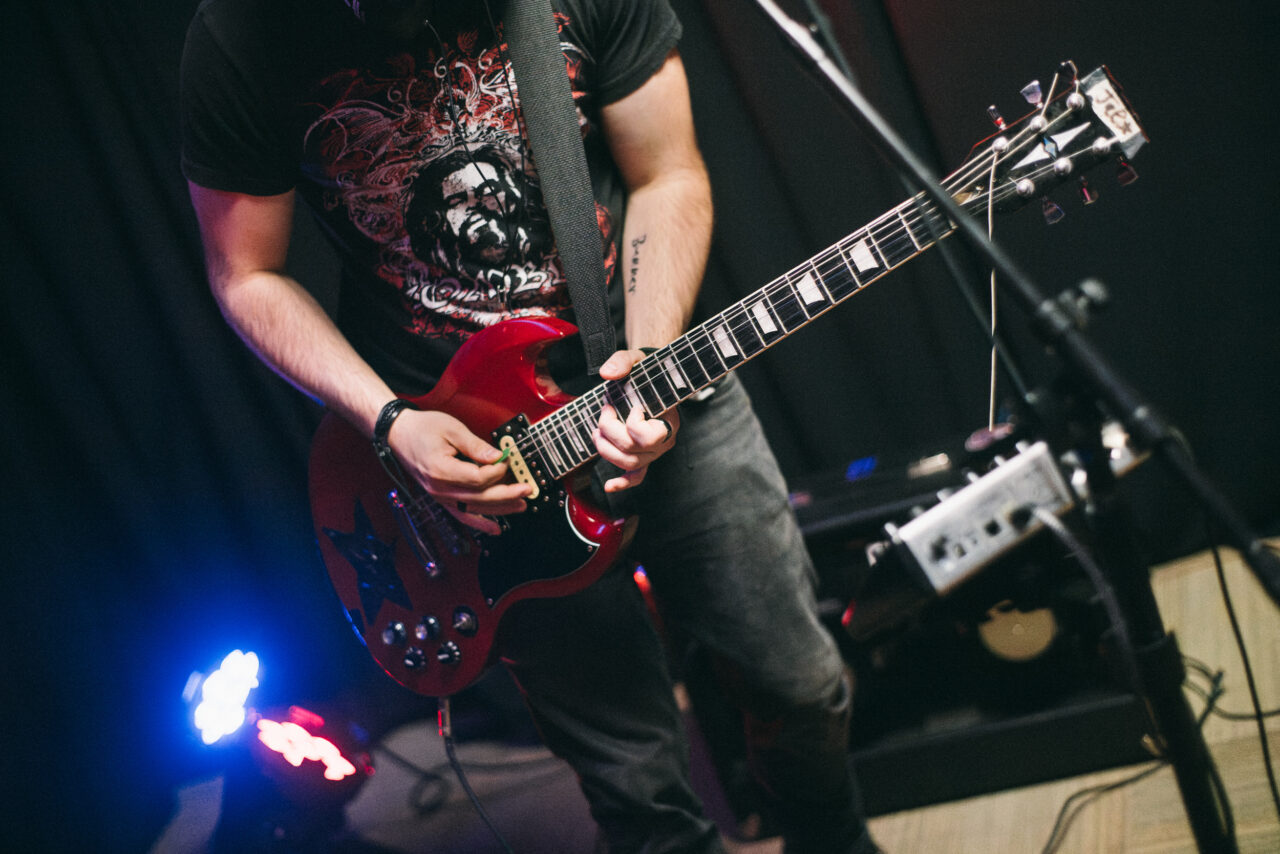 Closeup of a guitar player playing