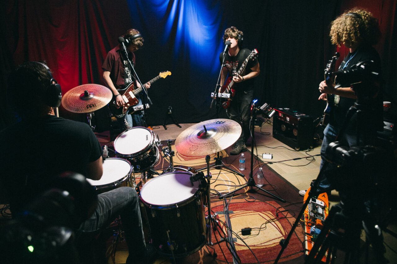 A band performing in a small room.