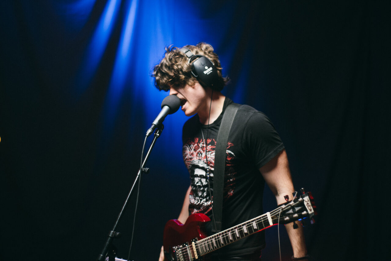 A singer singing into a microphone