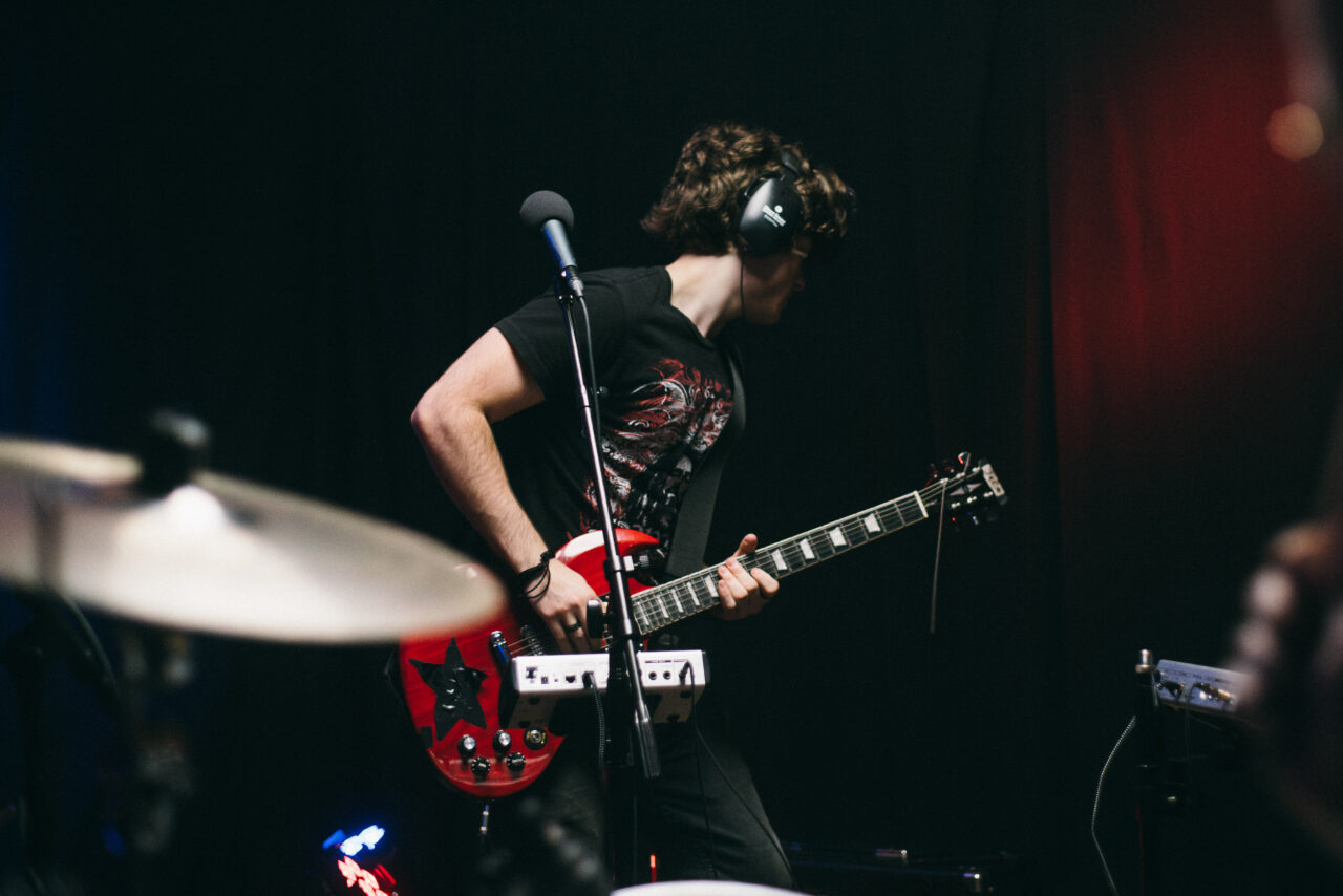 A person playing electric guitar