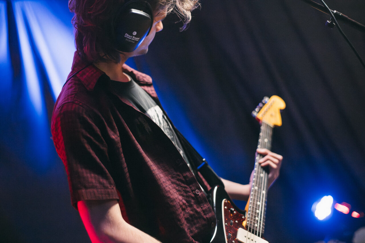 Closeup of a guitarist playing guitar