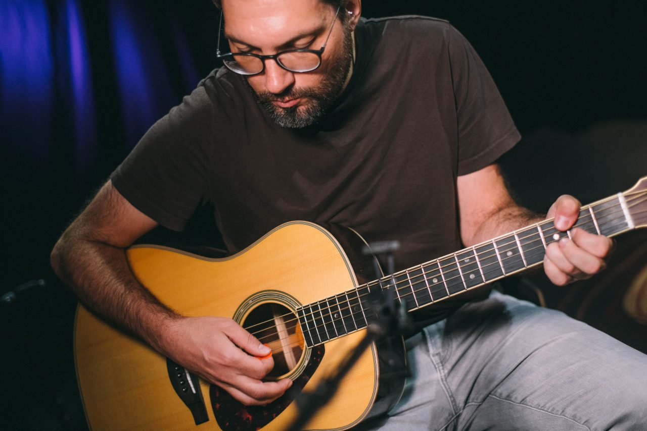 Guitarist Tyler Adkins playing guitar.