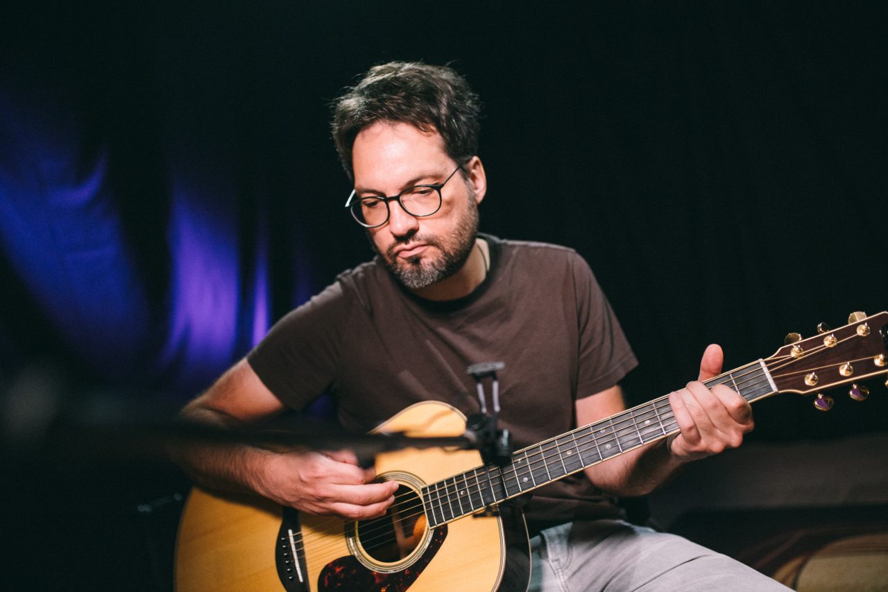Guitarist Tyler Adkins playing guitar.