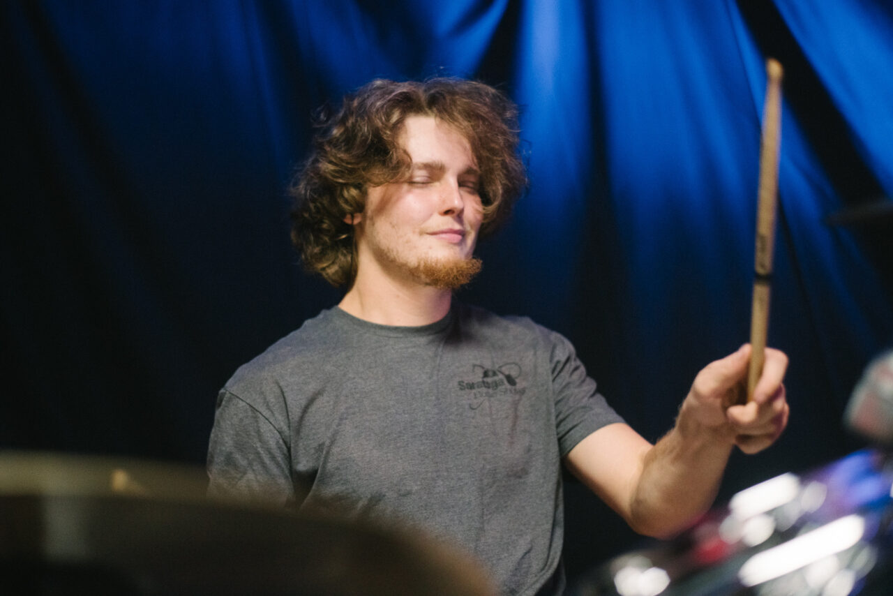 Logan Bedard playing drums.