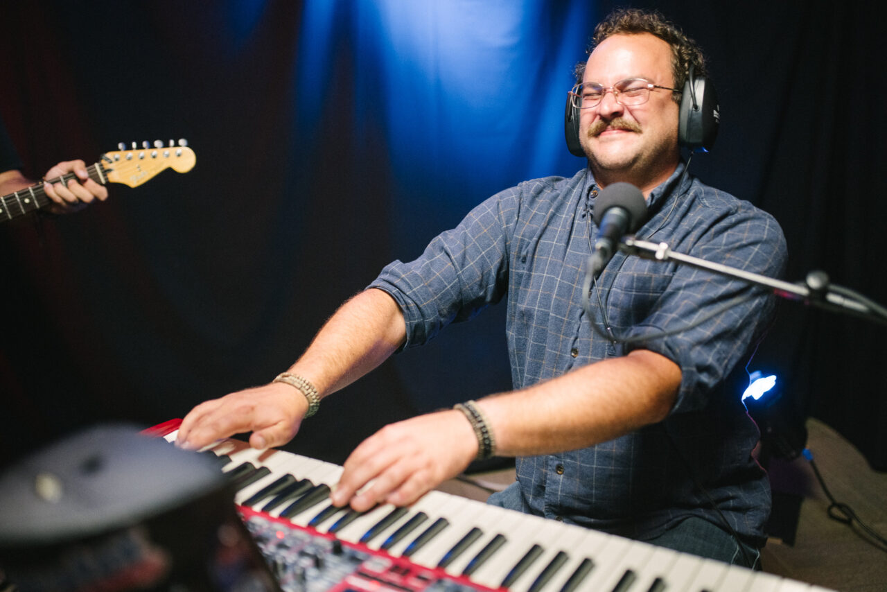 Zach Nyce playing keyboard.