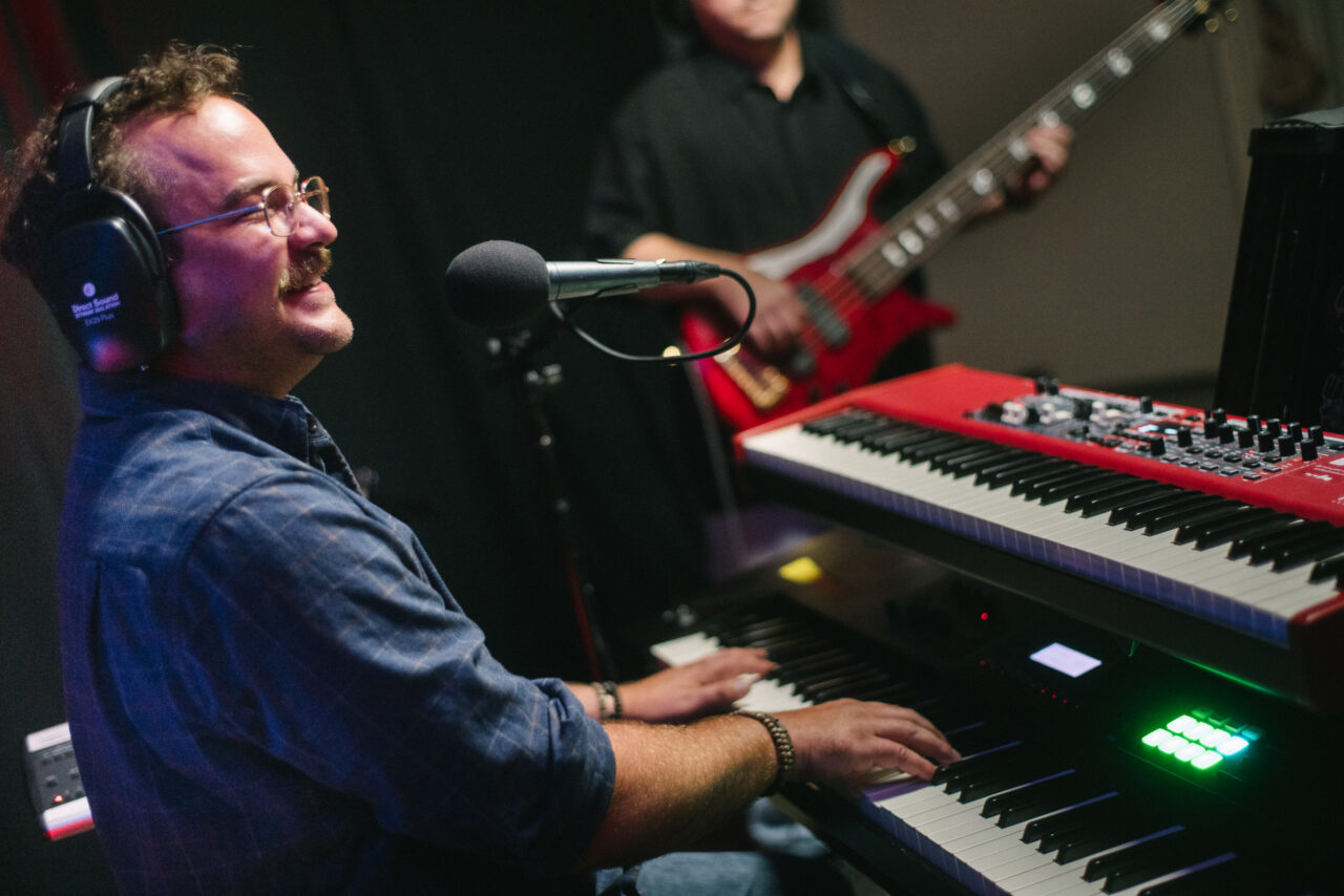 Zach Nyce playing keyboard.