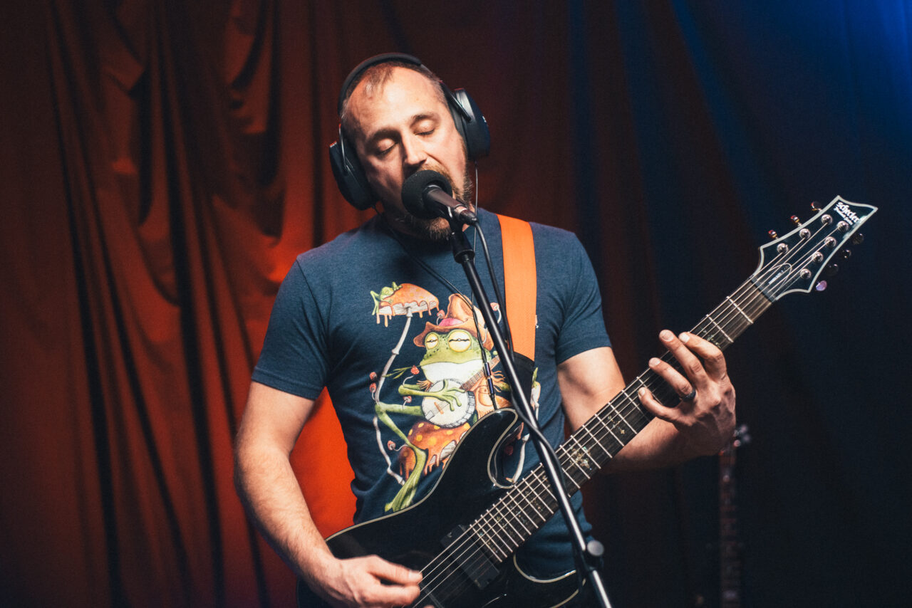 Matt Himes playing guitar.