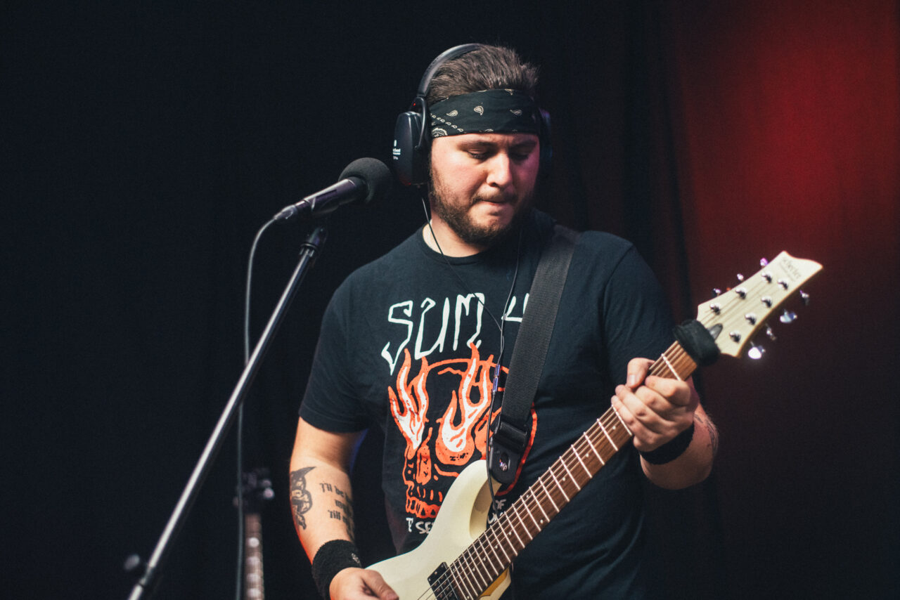 Jake Sholl playing guitar.