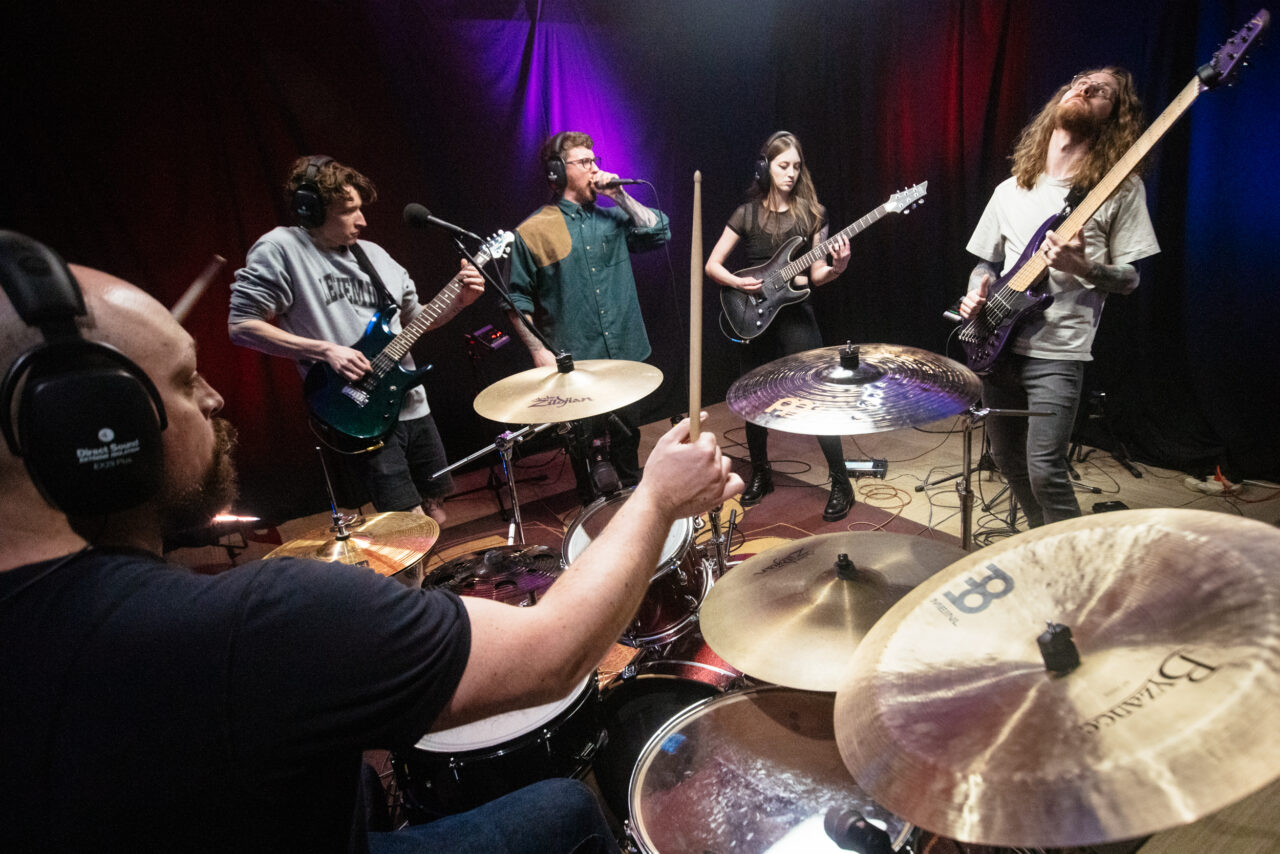 Making A Mockery playing in a small room.