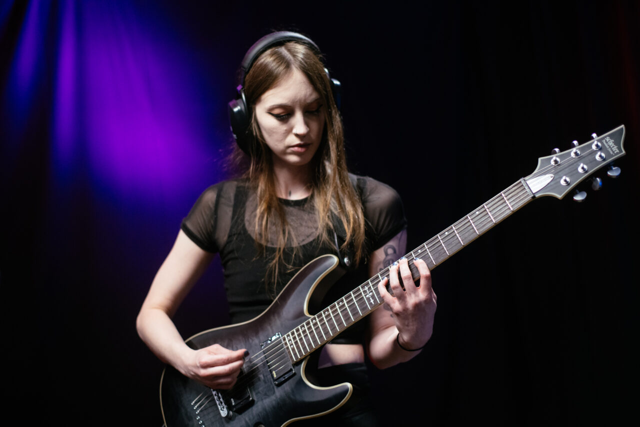 Guitarist in Making A Mockery playing guitar.
