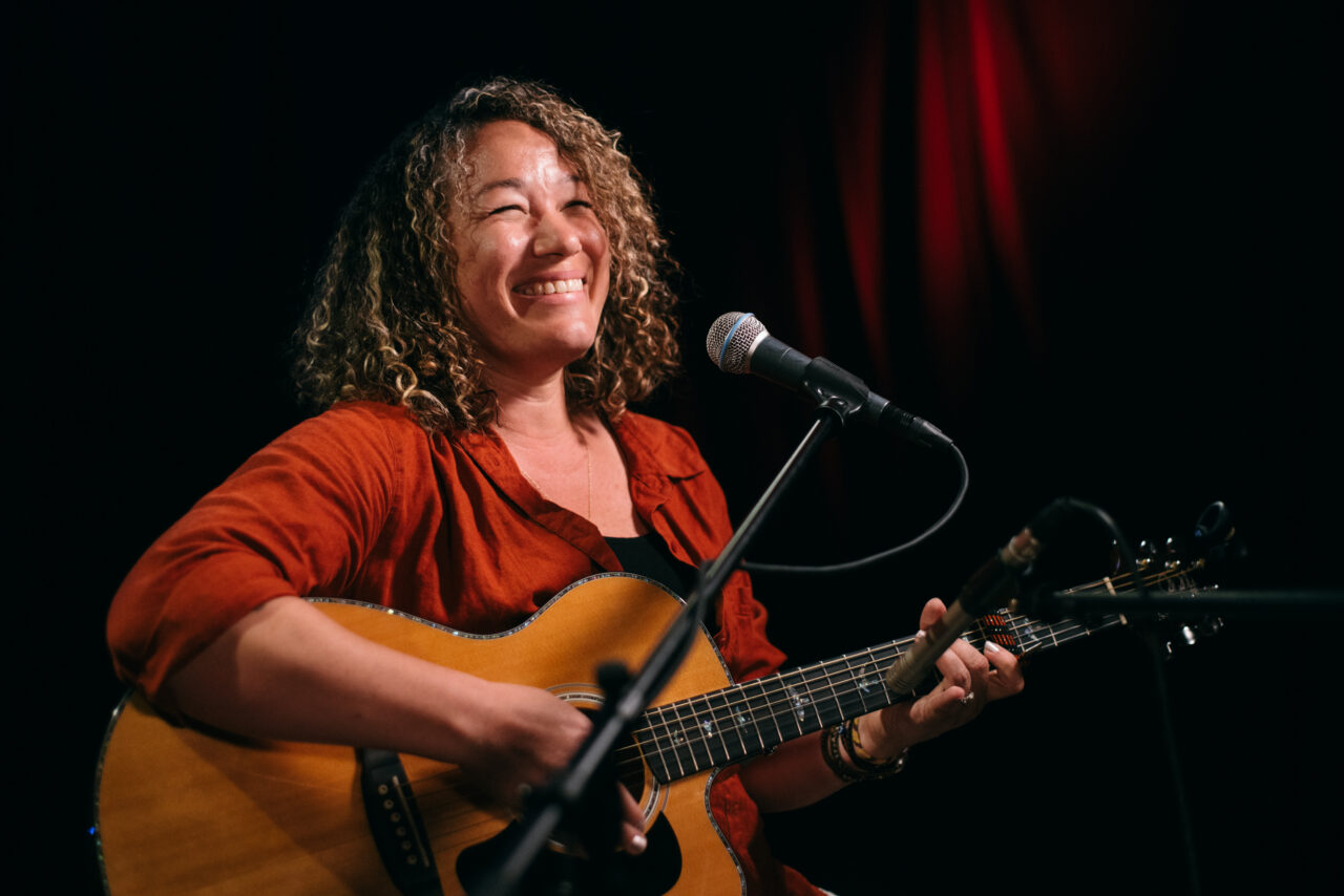 Singer/songwriter singing.