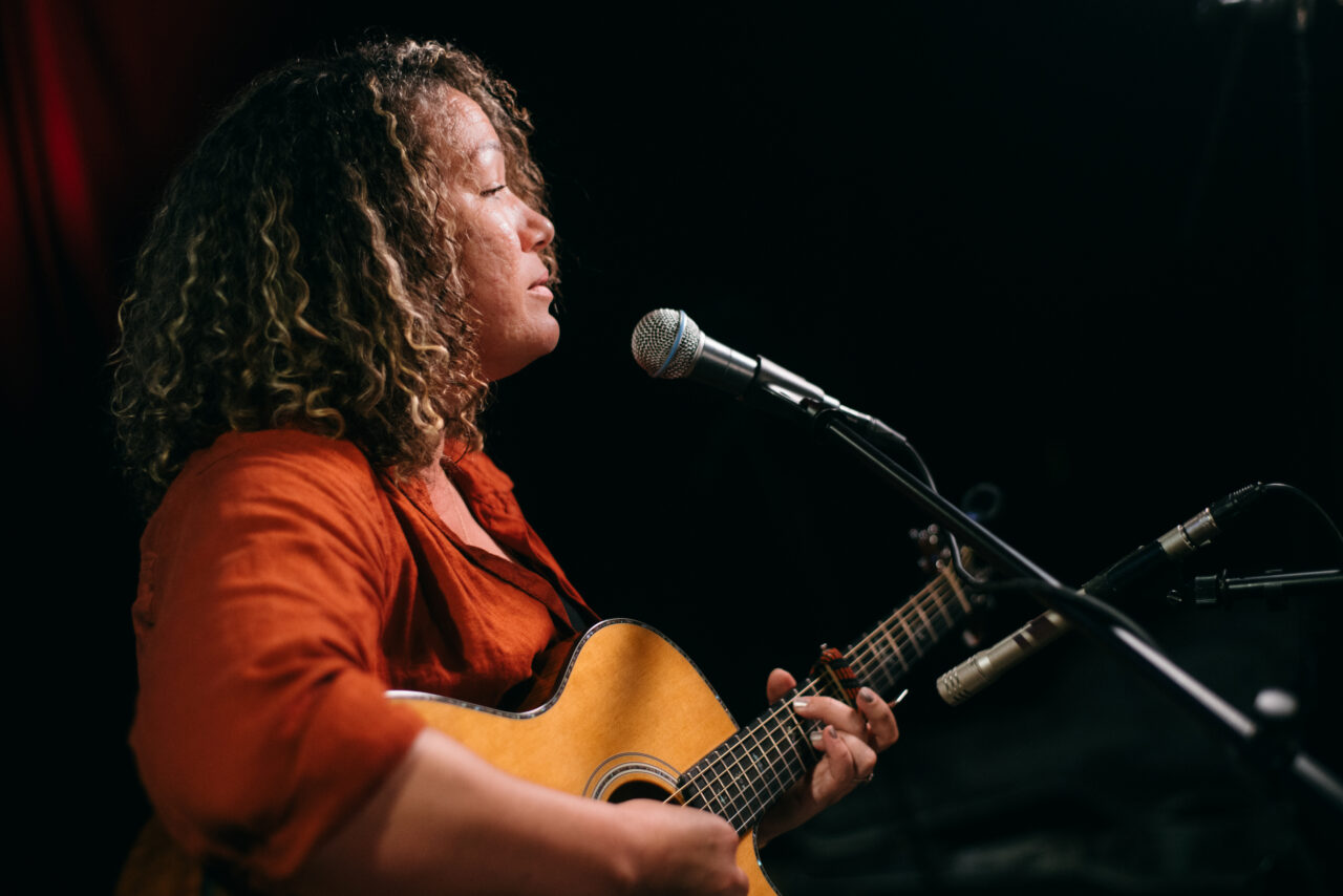 Singer/songwriter singing.