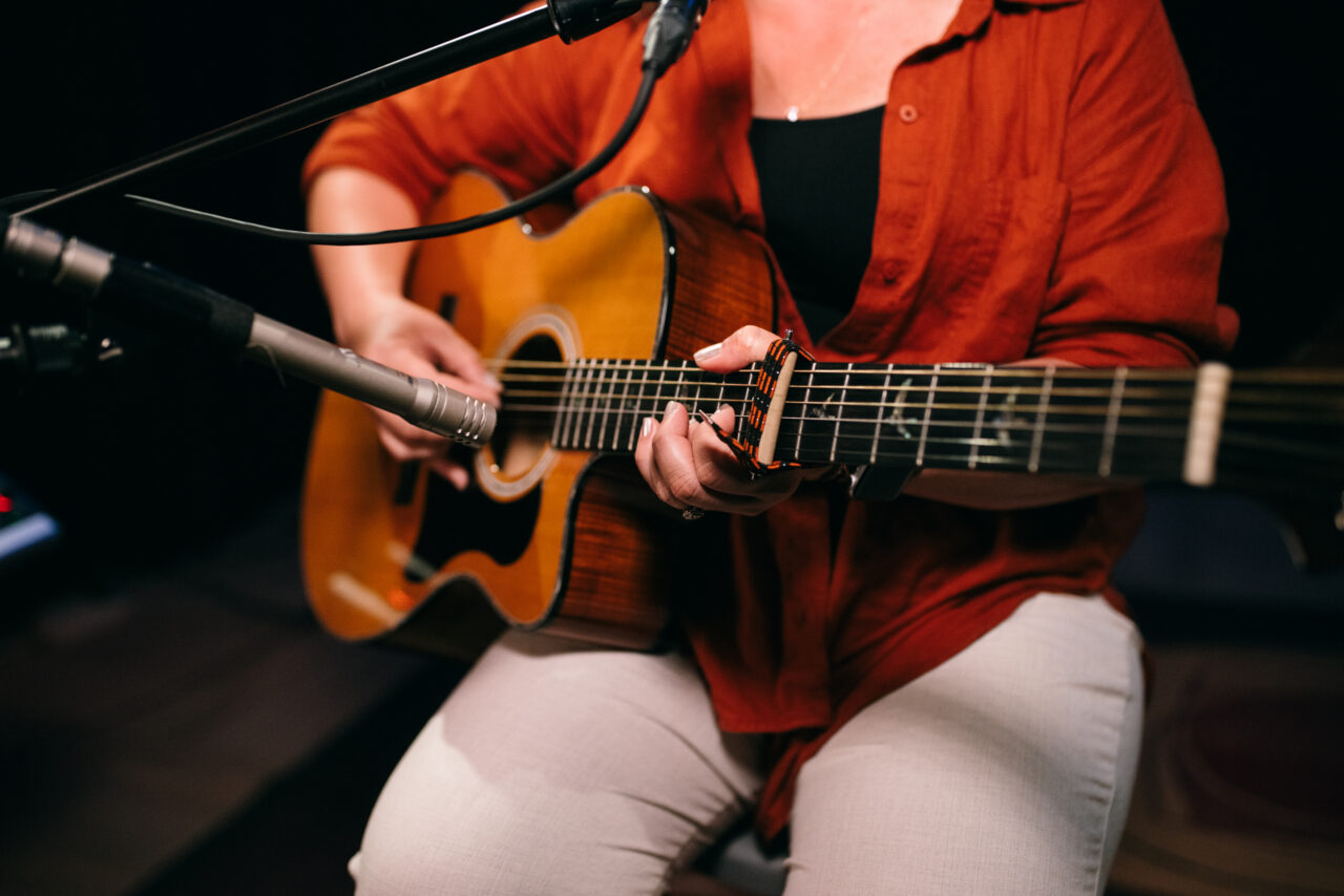 Singer/songwriter singing.