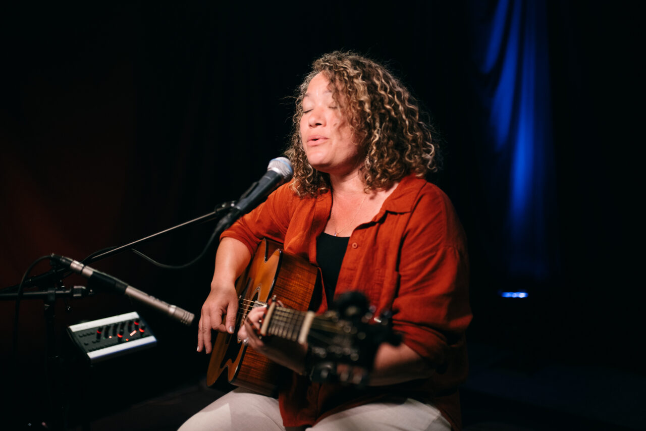 Singer/songwriter singing.
