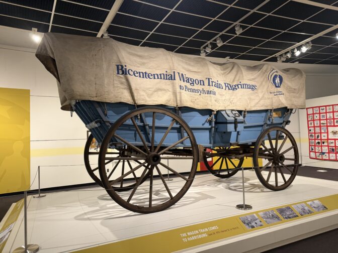 The exhibit includes a covered wagon used in the 1976 Bicentennial Wagon Train Pilgrimage to Pennsylvania.
