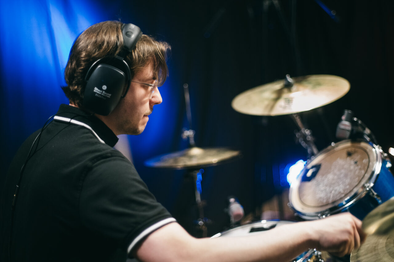 A person playing drums.