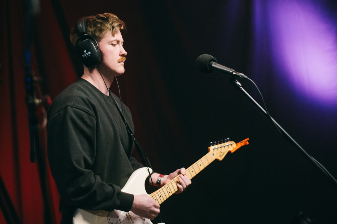 A person playing guitar.