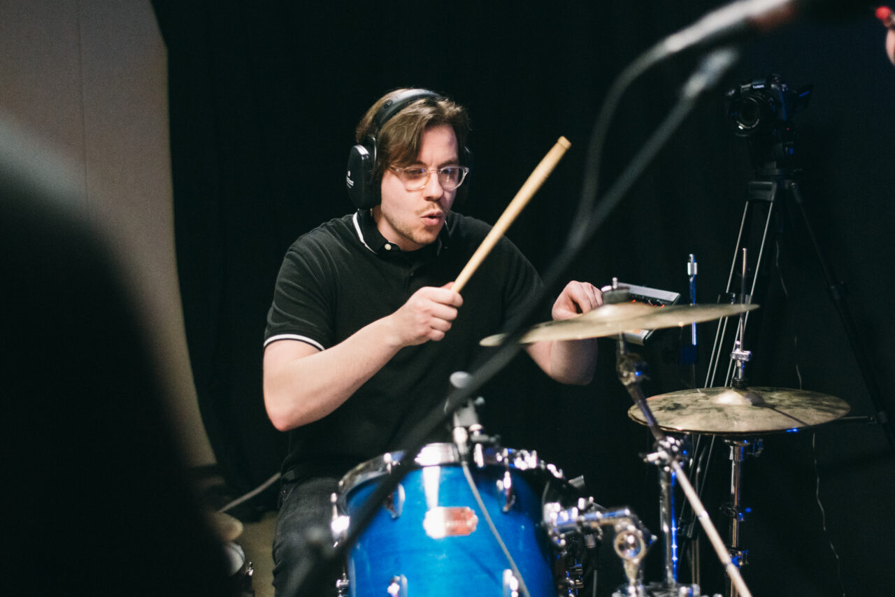 A person playing drums.