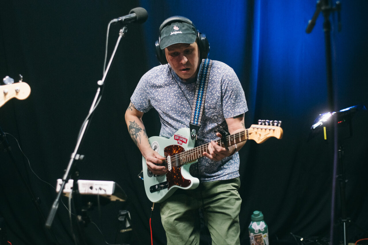 A person playing guitar.