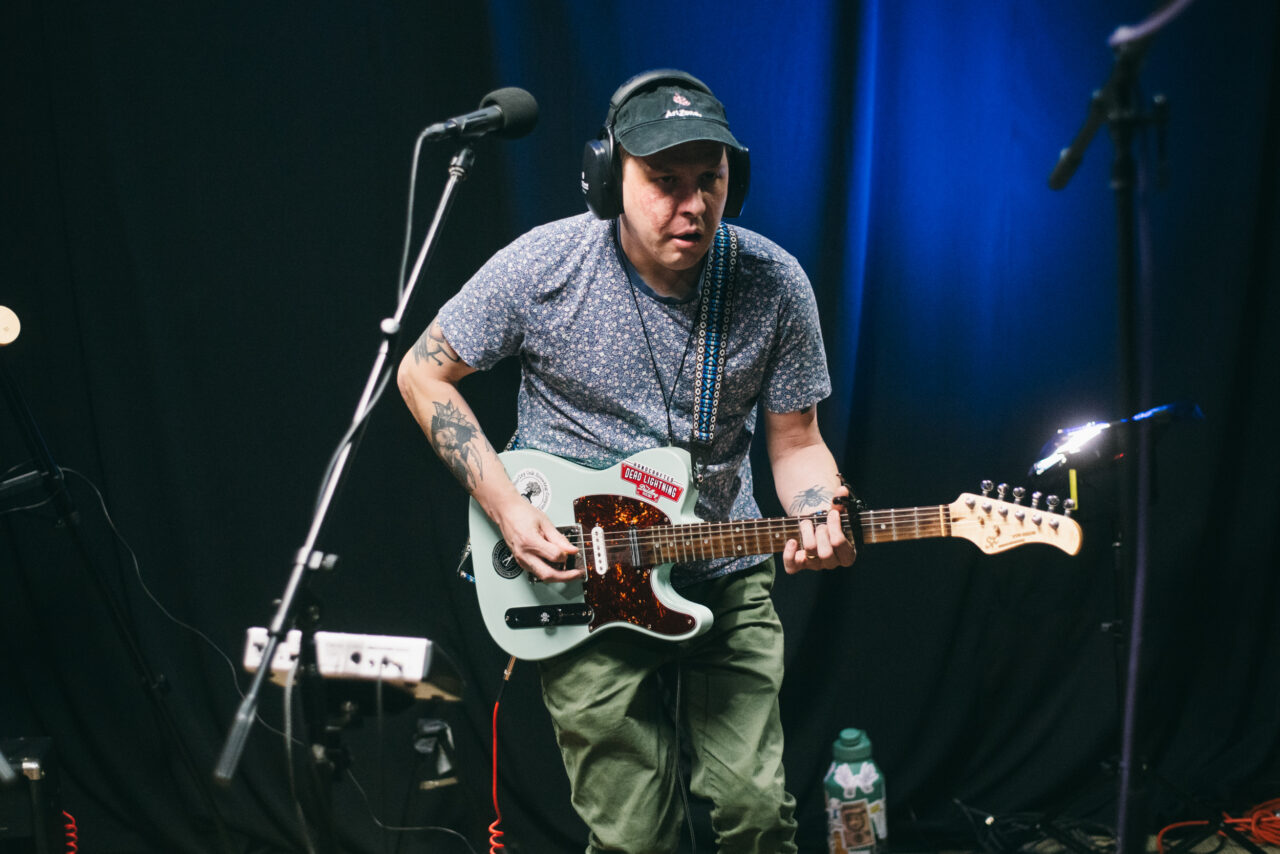 A person playing guitar.